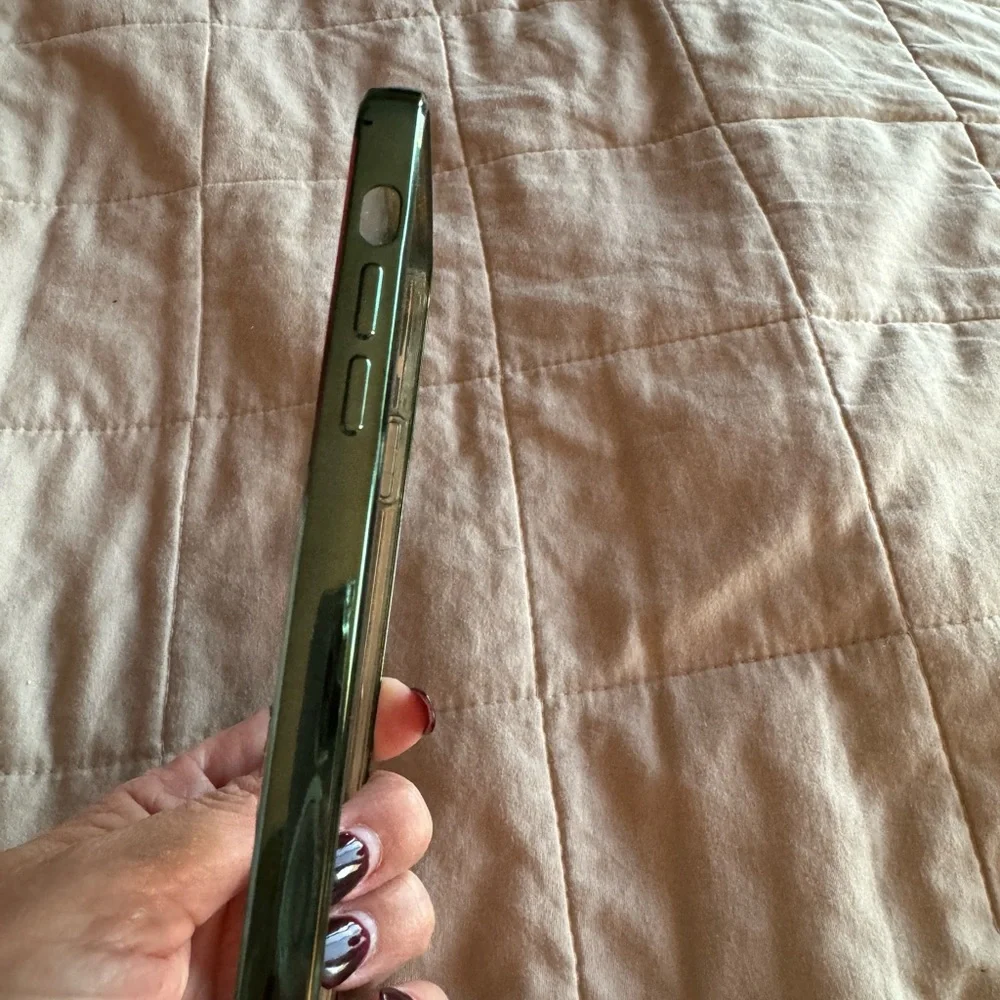 Iphone 11 pro max clear case with green trim. Has a ring phone holder